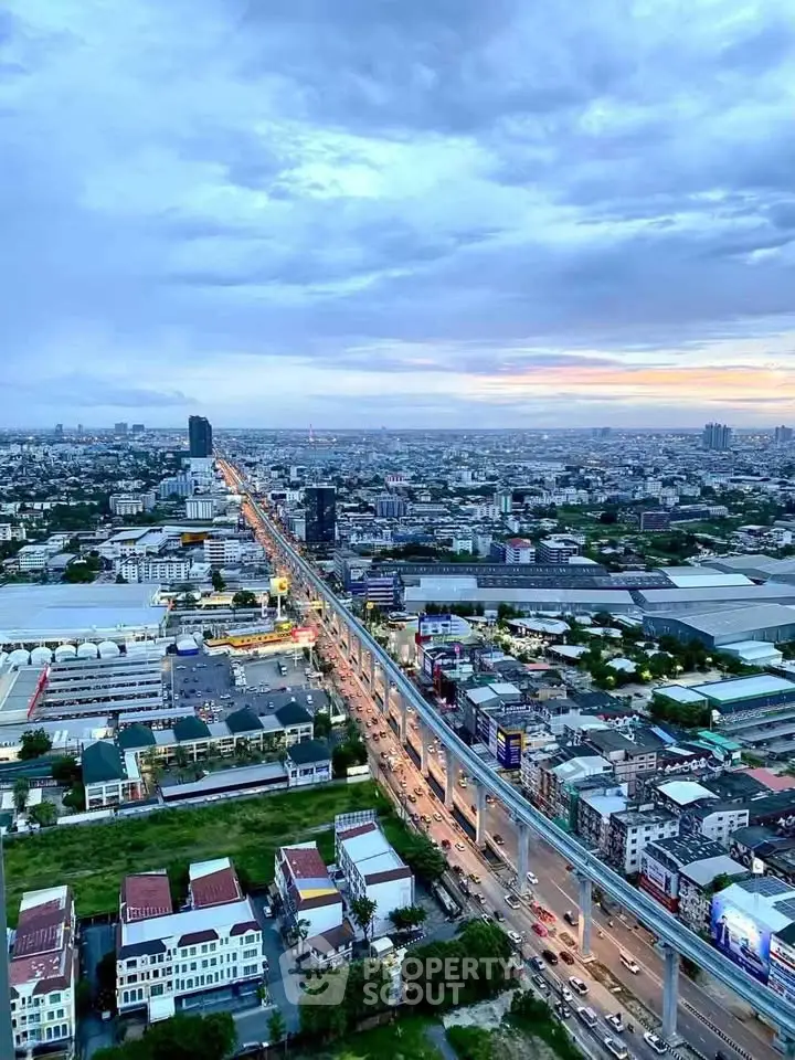 Stunning aerial view of urban landscape with vibrant cityscape and expansive skyline at sunset.