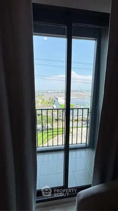 Stunning balcony view with expansive cityscape and lush greenery, perfect for relaxation and enjoying the outdoors.