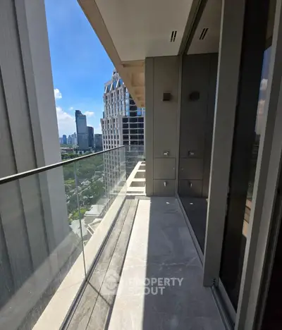 Luxurious high-rise balcony with stunning cityscape views and modern glass railing.