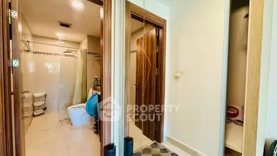 Spacious bathroom with modern fixtures and ample storage space in a contemporary home.