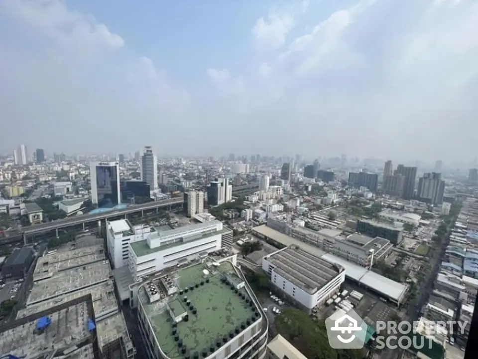 Stunning cityscape view from high-rise building showcasing urban skyline and architecture.