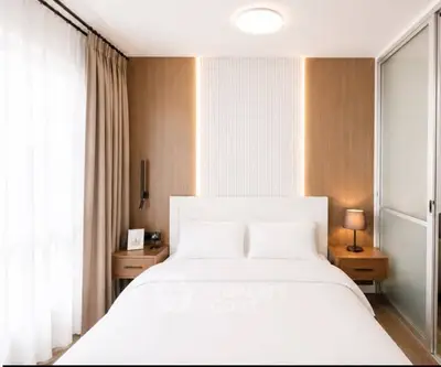 Modern bedroom with elegant lighting and cozy decor