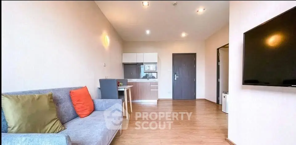 Modern living room with stylish decor and open kitchen layout