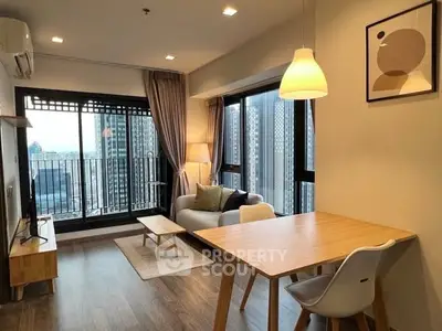 Modern living room with balcony view in high-rise apartment