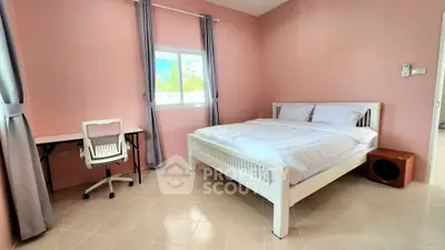 Spacious bedroom with modern decor and natural light