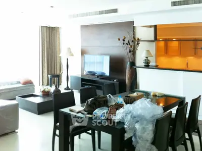 Spacious modern living room with elegant dining area and stylish decor