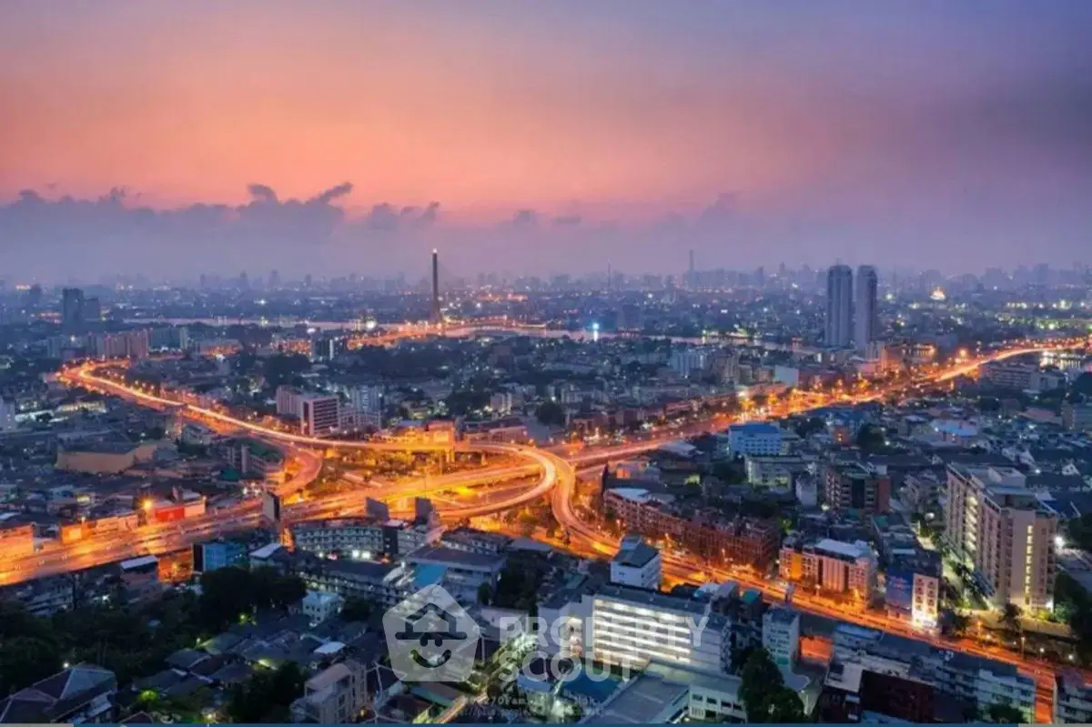 Stunning cityscape view at dusk with vibrant skyline and illuminated streets.