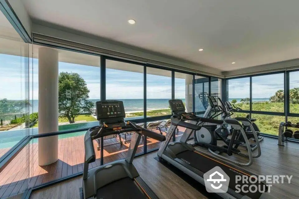 Luxury gym with panoramic ocean view and modern equipment