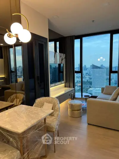 Luxurious modern living room with stunning city view, elegant furniture, and chic lighting in high-rise apartment.