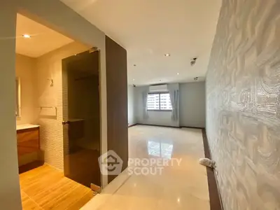 Spacious modern living room with elegant design and ample natural light