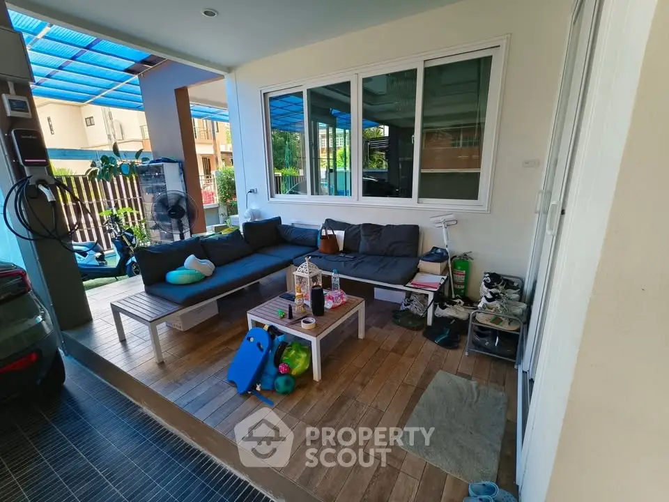 Charming outdoor patio with cozy seating and vibrant decor, perfect for relaxation and entertaining.