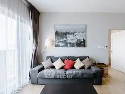 Modern living room with stylish sofa and large window for natural light