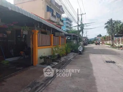 Charming residential street with cozy homes and lush greenery in a peaceful neighborhood.