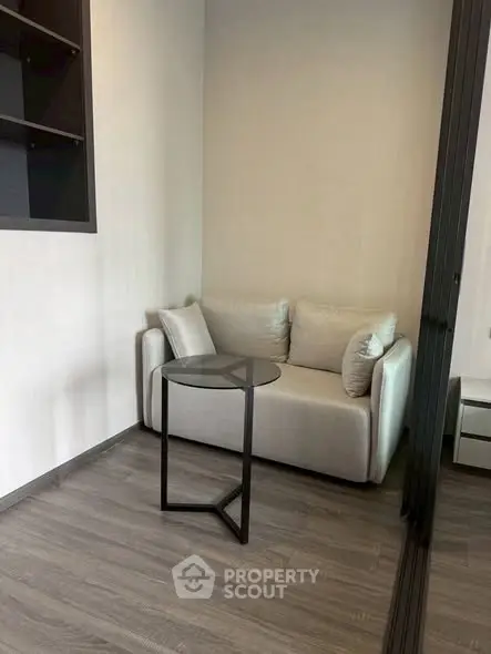 Cozy modern living room corner with stylish sofa and glass table