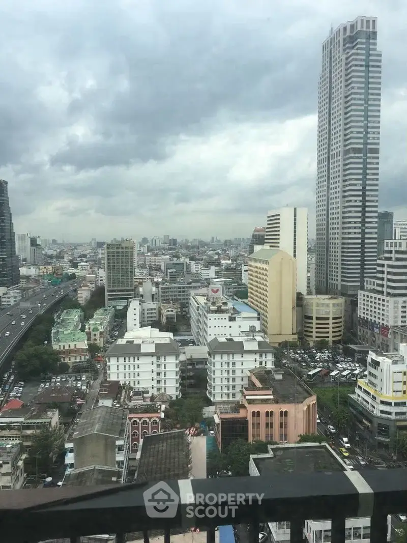 Stunning cityscape view from a high-rise building showcasing urban skyline and architecture.
