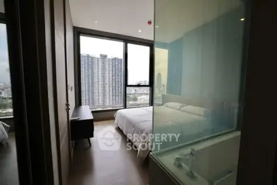 Modern bedroom with city view in high-rise apartment