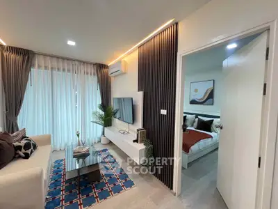 Modern living room with stylish decor and cozy bedroom view