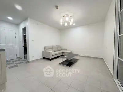 Spacious minimalist living room with modern chandelier and sleek furniture