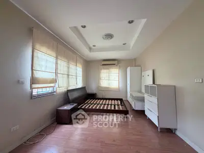 Spacious bedroom with modern design and ample natural light
