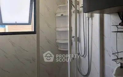 Modern bathroom with sleek shower and elegant tile design, perfect for a contemporary home.