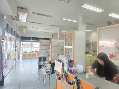 Spacious commercial retail space with modern shelving and bright lighting, ideal for business setup.