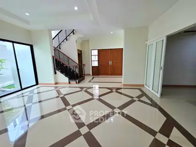 Spacious modern living room with elegant tile flooring and natural light
