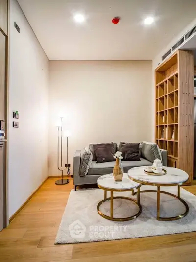 Modern living room with cozy sofa and stylish coffee tables