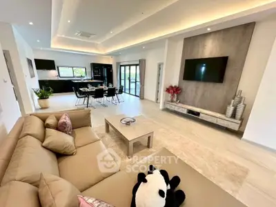Spacious modern living room with open kitchen and stylish decor