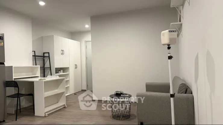 Modern minimalist living room with sleek furniture and neutral tones, perfect for urban living.