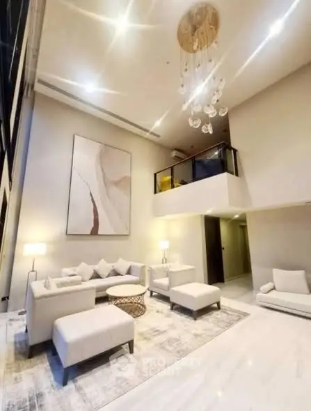 Luxurious modern living room with high ceilings and elegant decor