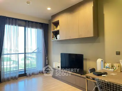 Modern living room with large window and stylish wooden furniture