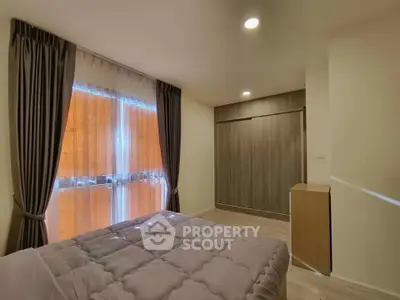 Cozy bedroom with modern design and ample natural light