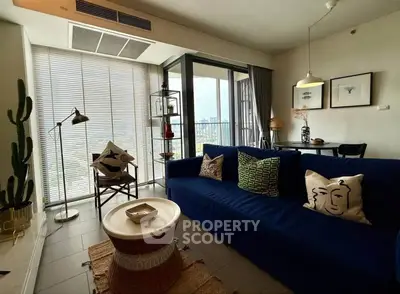 Stylish living room with modern decor and balcony view