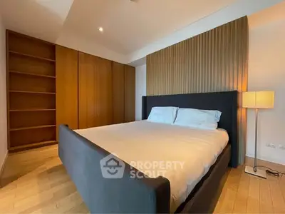 Spacious modern bedroom with elegant wooden accents and cozy lighting