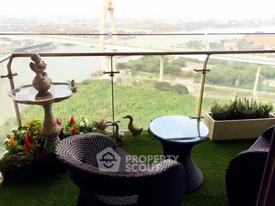 Stunning balcony with river view, stylish furniture, and lush greenery for a perfect relaxation spot.