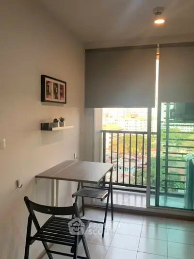 Cozy balcony with city view, perfect for relaxation and enjoying the skyline.