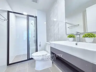 Modern bathroom with sleek design and glass shower enclosure