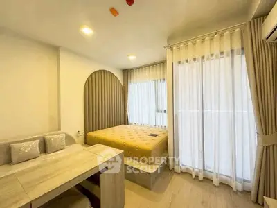 Modern bedroom with stylish decor and natural light