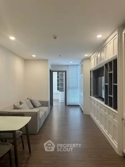 Modern living room with elegant built-in shelving and cozy seating area