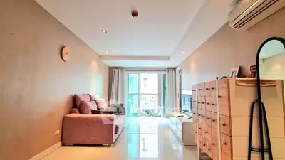 Spacious living room with modern decor and natural light