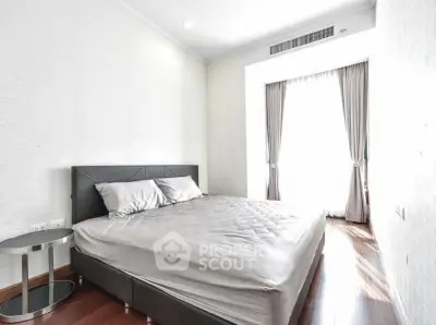 Bright and airy bedroom with modern decor and large window