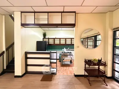 Charming open-layout kitchen with modern appliances and stylish decor in a cozy home setting.