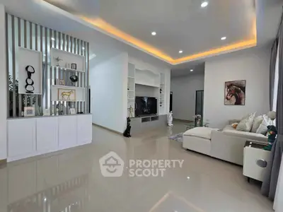 Spacious modern living room with elegant decor and ambient lighting