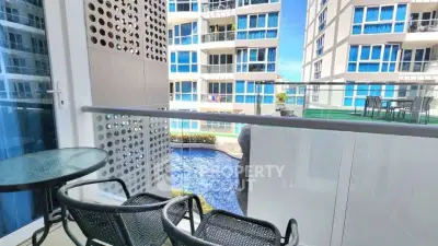 Modern balcony with pool view in luxury apartment complex