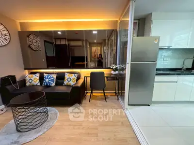 Modern open-plan living room with sleek kitchen and stylish decor