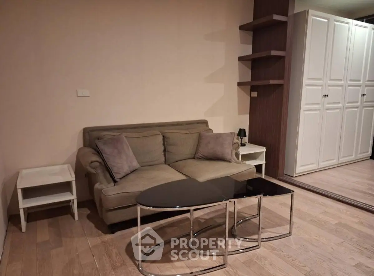 Cozy living room with modern sofa and stylish coffee table in a chic apartment.
