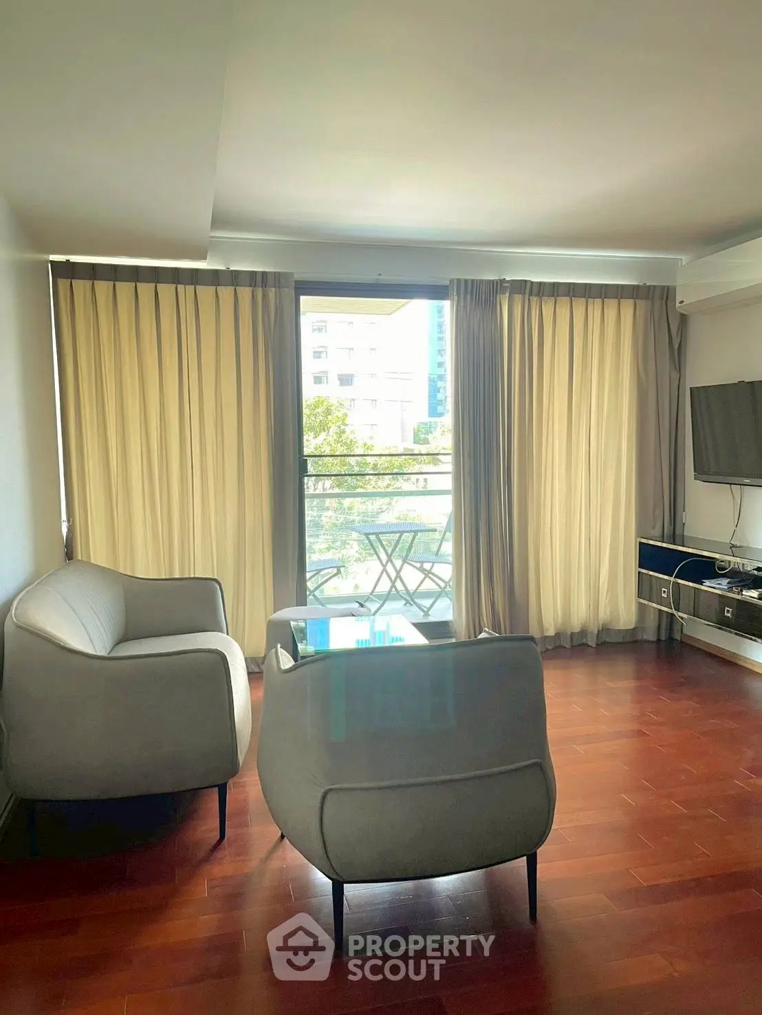 Modern living room with balcony view and stylish furniture