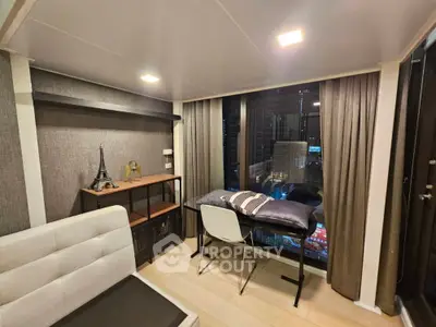 Modern study room with city view, stylish decor, and cozy seating area.