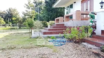 Charming countryside home with lush garden and inviting entrance