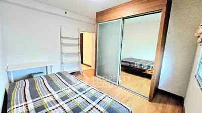 Modern bedroom with mirrored wardrobe and stylish decor